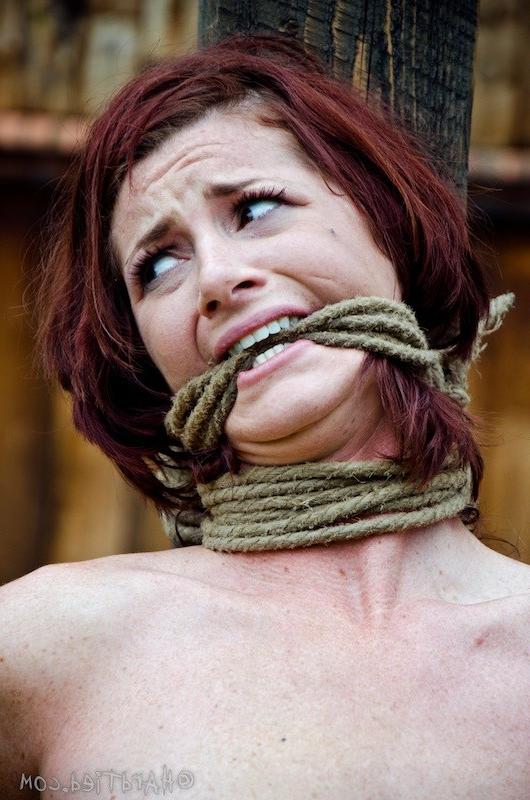 16P Cici Rhodes redhead is bound outdoors her tits with clothes pins