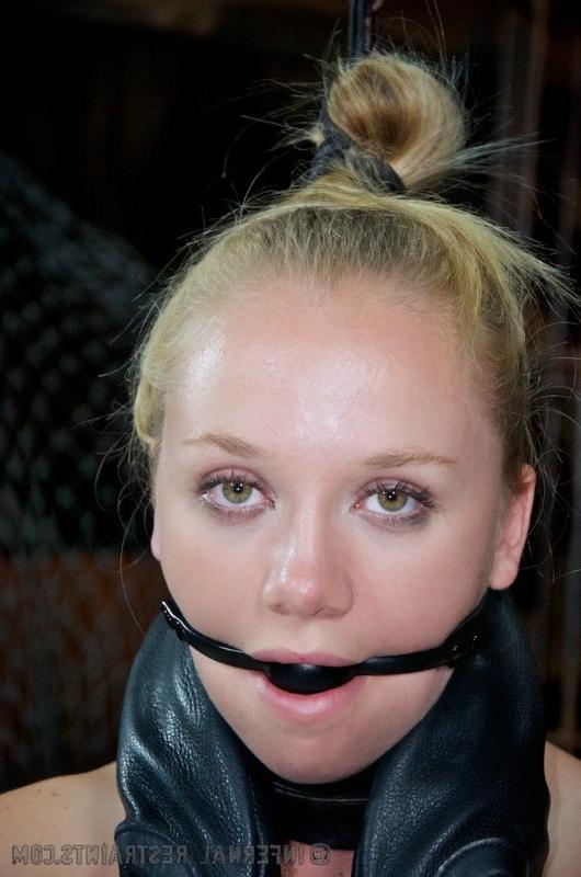 16P Tracy Sweet gagged blonde is bound with straps her pussy exposed
