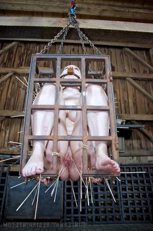 16P Dixon Mason is bound in metal her pussy exposed and toyed