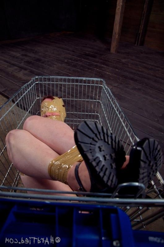 16P Maggie Mead bound in rope wearing high heels her mouth gagged