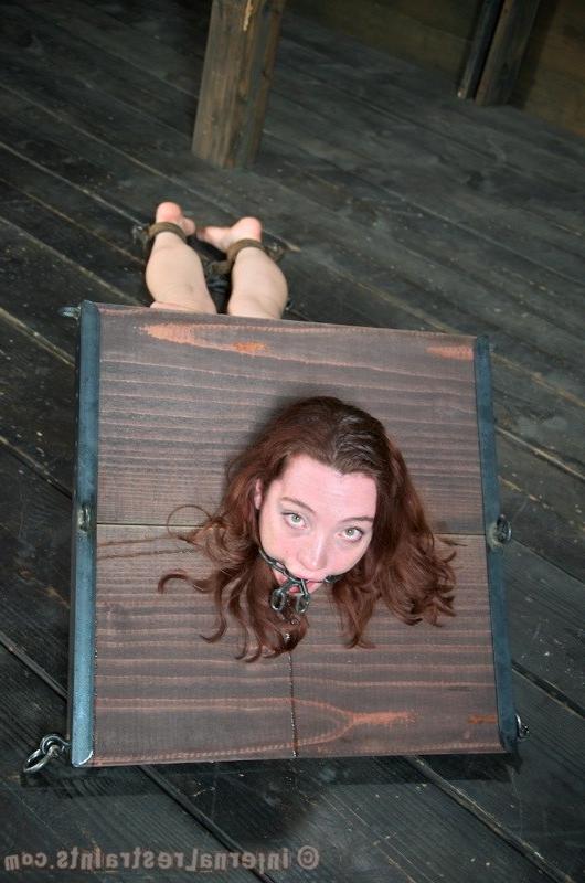 16P Maggie Mead bound in wooden stock her shaved pussy vibrated