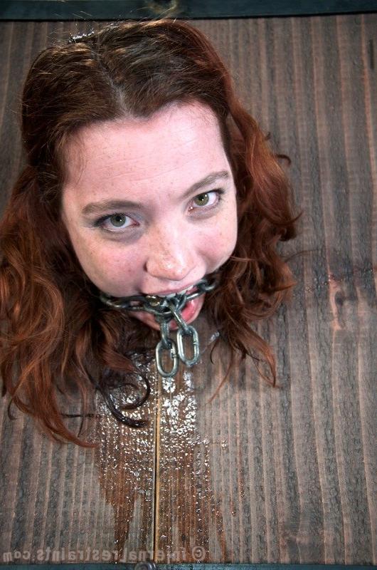 16P Maggie Mead bound in wooden stock her shaved pussy vibrated