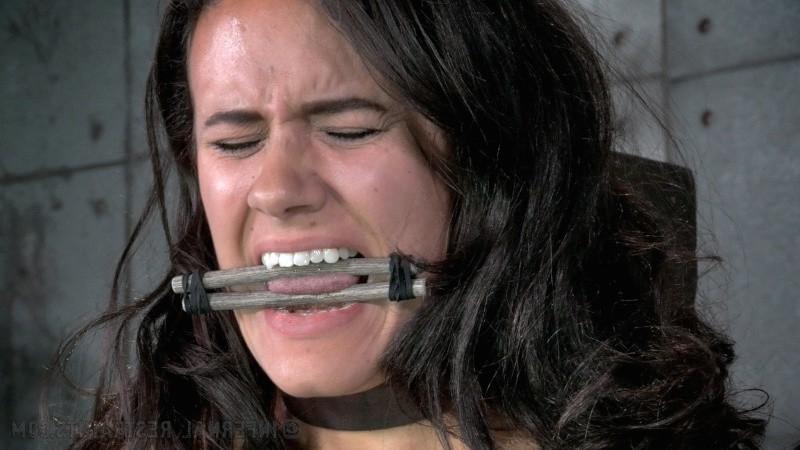 16P Penny Barber bound in wooden stocks with tits and pussy exposed in dungeon