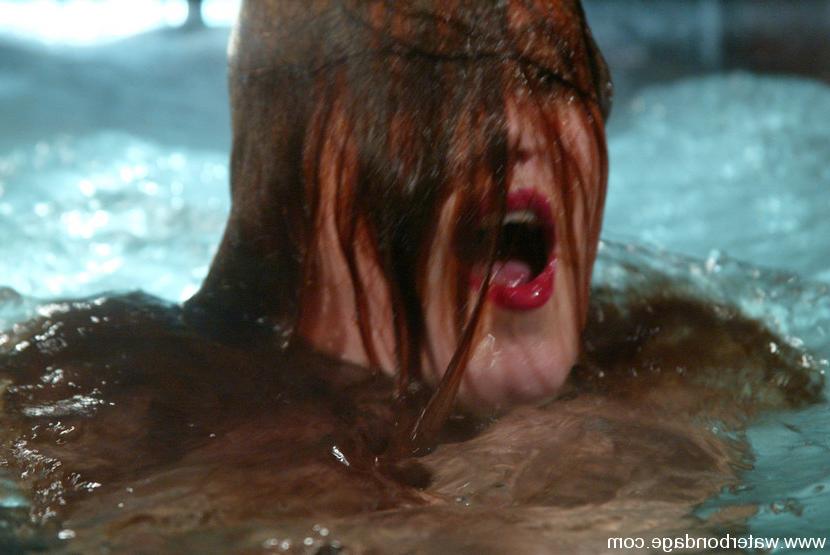 15P Sabrina Fox statuesque redhead is bound and put in watertank