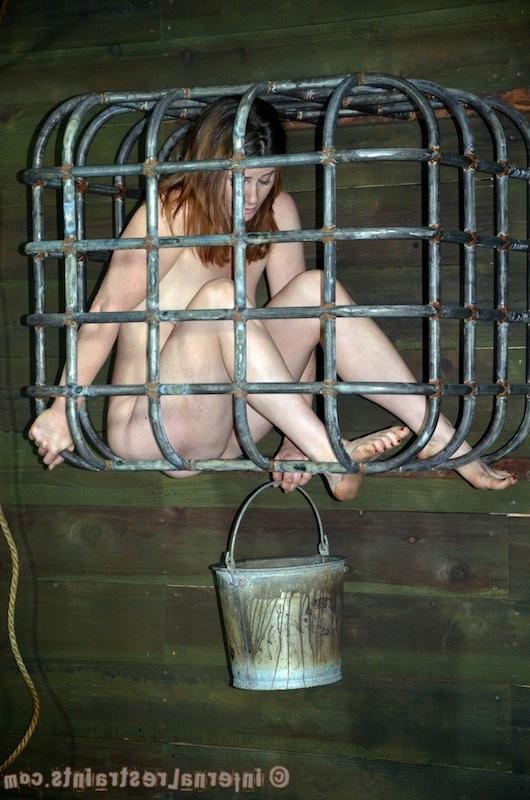 16P Cici Rhodes is bound in chains and put in cage in dungeon