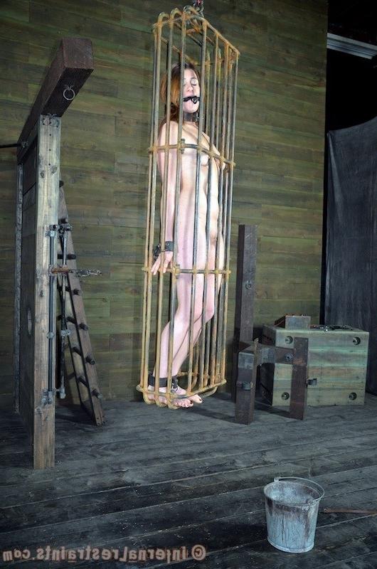 16P Cici Rhodes is bound in chains and put in cage in dungeon