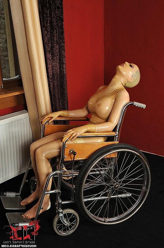 16P Latex Lucy busty babe in latex is bound to wheelchair and toyed