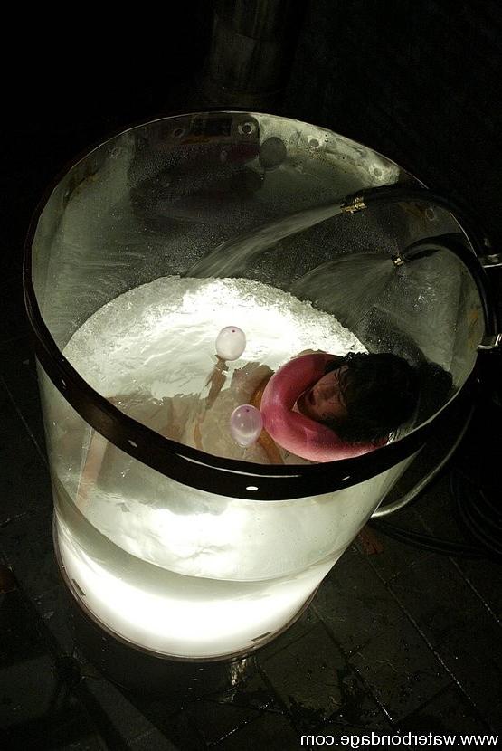 15P Stacy Stax busty babe is bound in rope and dunked in water tank