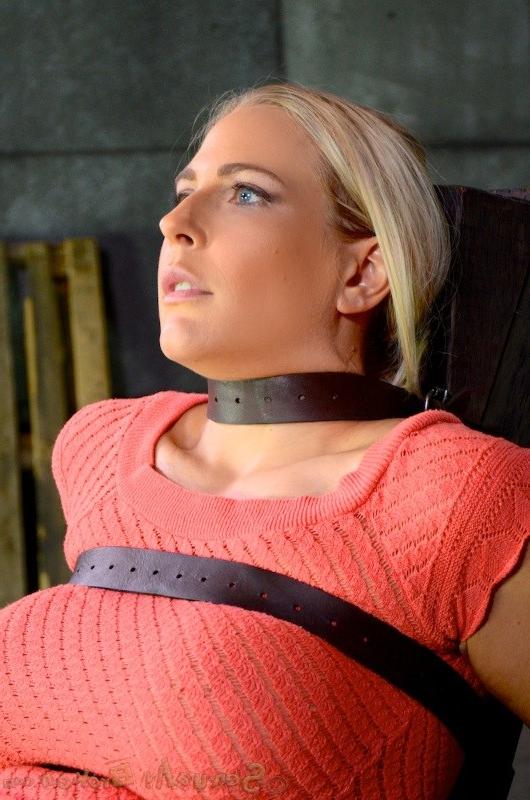 12P Angel Allwood bound with leather straps to a kinky chair