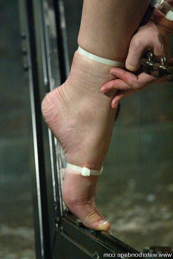15P Amber Rayne girl is bound upside down in watertank