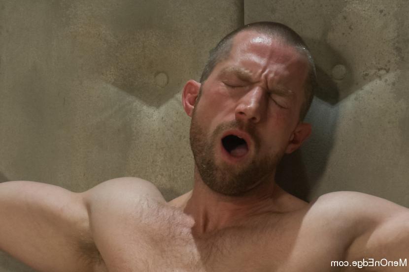 15P Adam Herst has his huge cock edged while bound in a straight jacket inside a pad