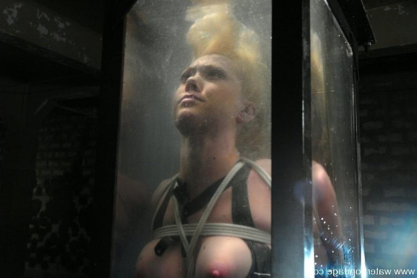 15P Samantha Sin blonde is bound dunked in watertank and toy fucked