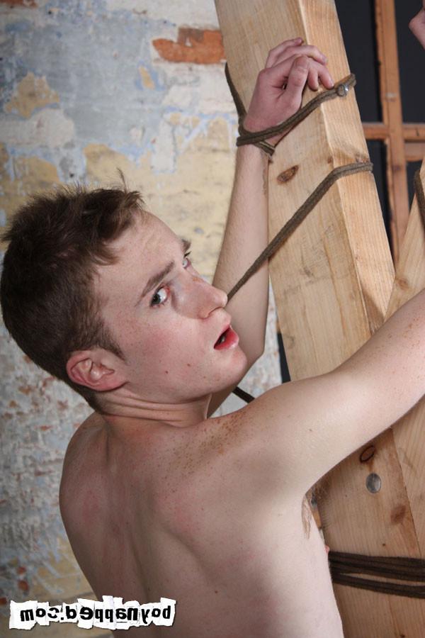 15P Restrained against a cross, Justin James can't even see what's coming when Ashto