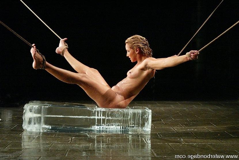 15P Isis Love blonde is rope bound in watertank and put on ice