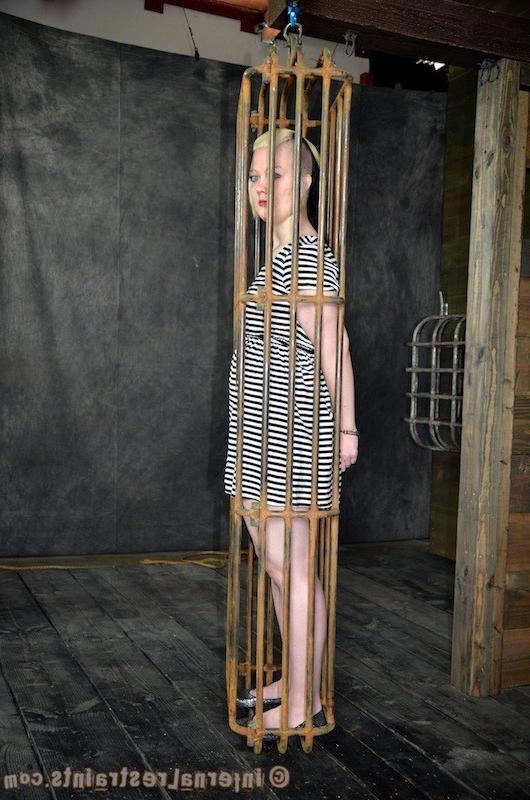16P Denali Winter in cage is bound and spanked her tits exposed