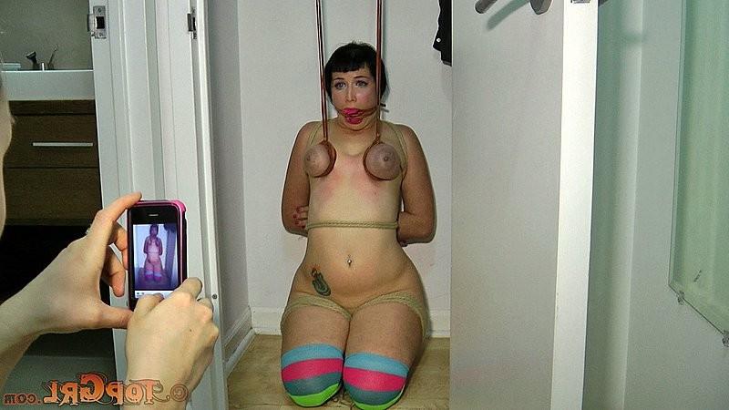 16P Niki Nymph is rope bound with tits exposed and gagged by lezdom
