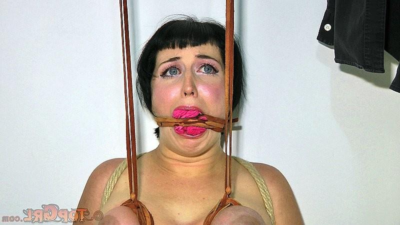 16P Niki Nymph is rope bound with tits exposed and gagged by lezdom