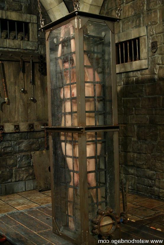 15P Hung above the Houdini tank in a cage Sasha awaits her fate...
