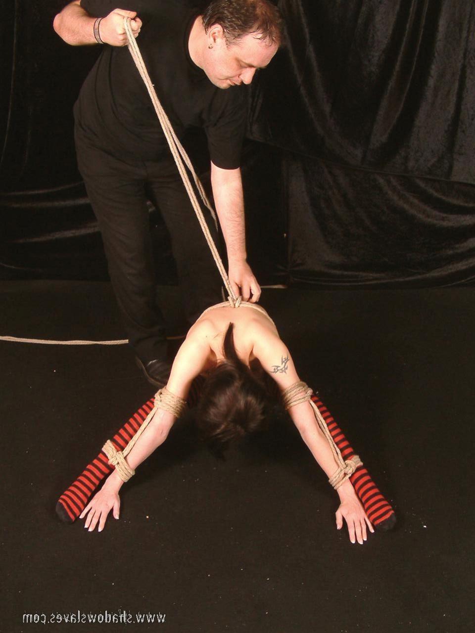 15P Cute brunette slavegirl is bound tightly with ropes and dildoed