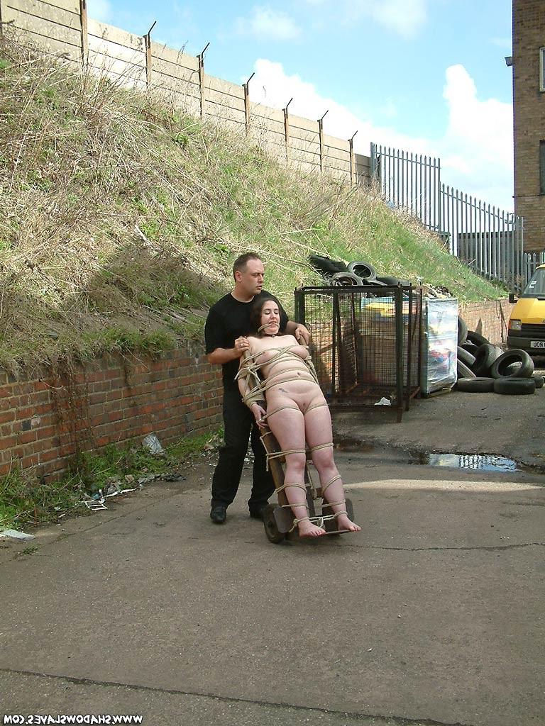 15P Slavegirl bound to a sacktruck
