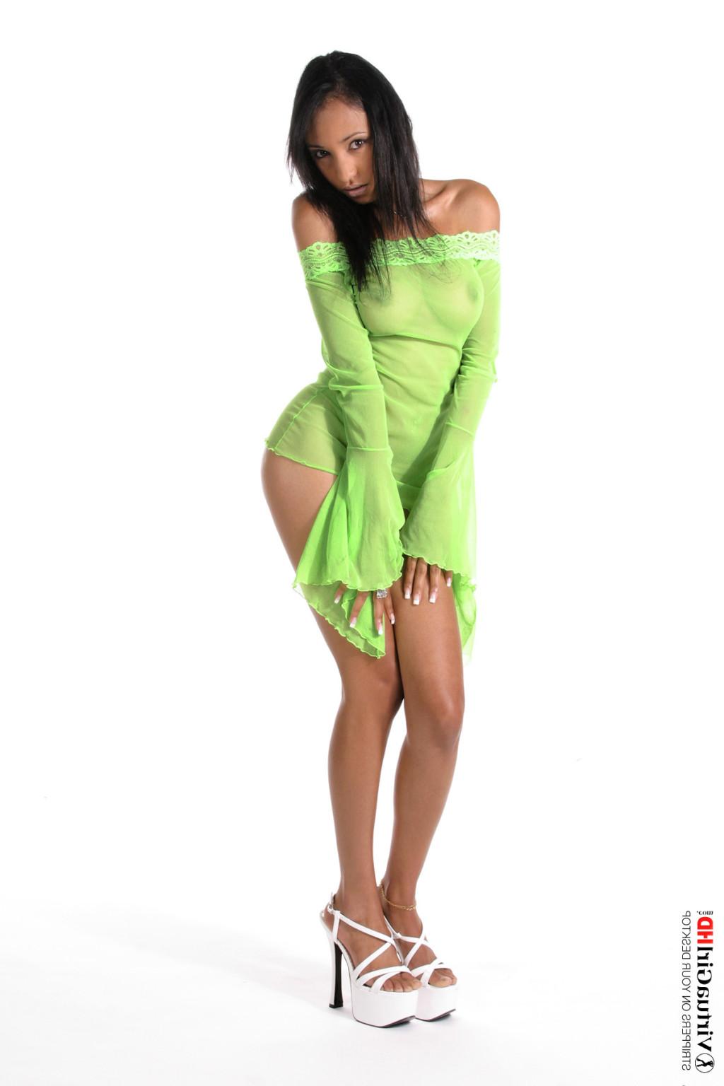 15P Hot tanned brunette taking off her sexy green lingerie