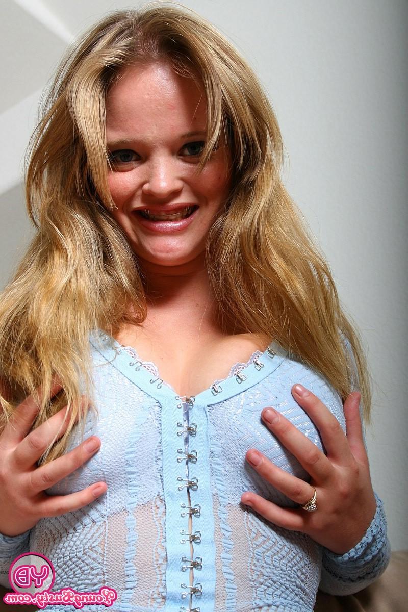 14P Big breasted teenage blonde strips to show her massive tits