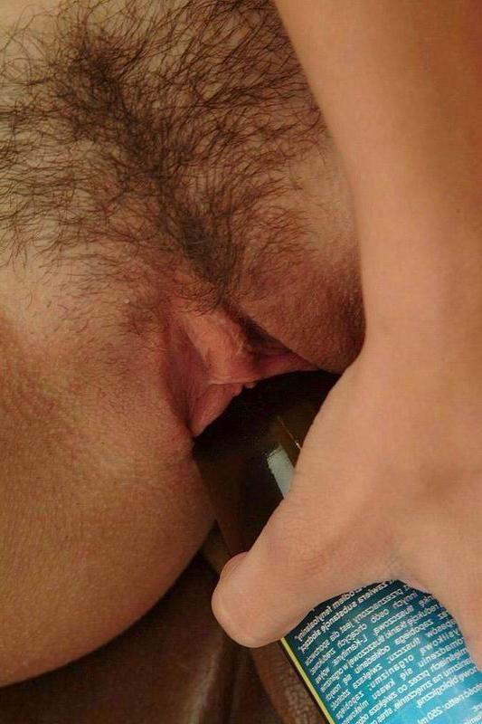 15P teen sliding a bottle in her hairy pussy