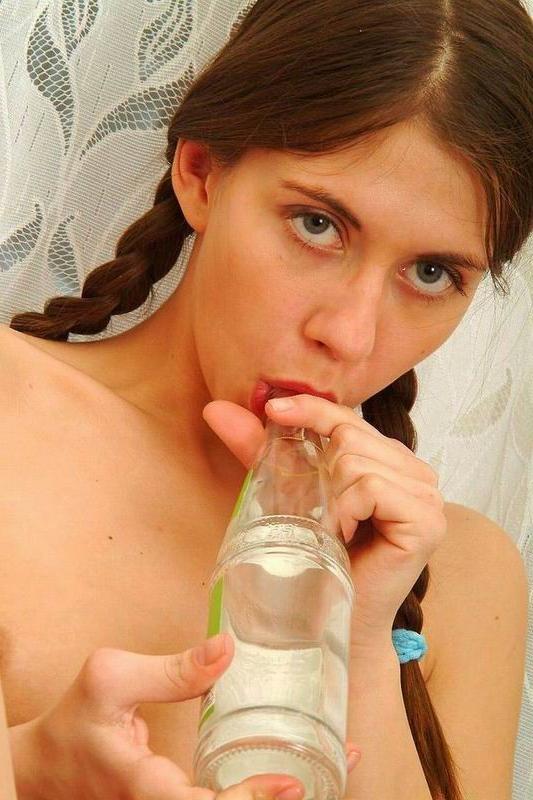 15P Teen sliding a bottle in her pussy