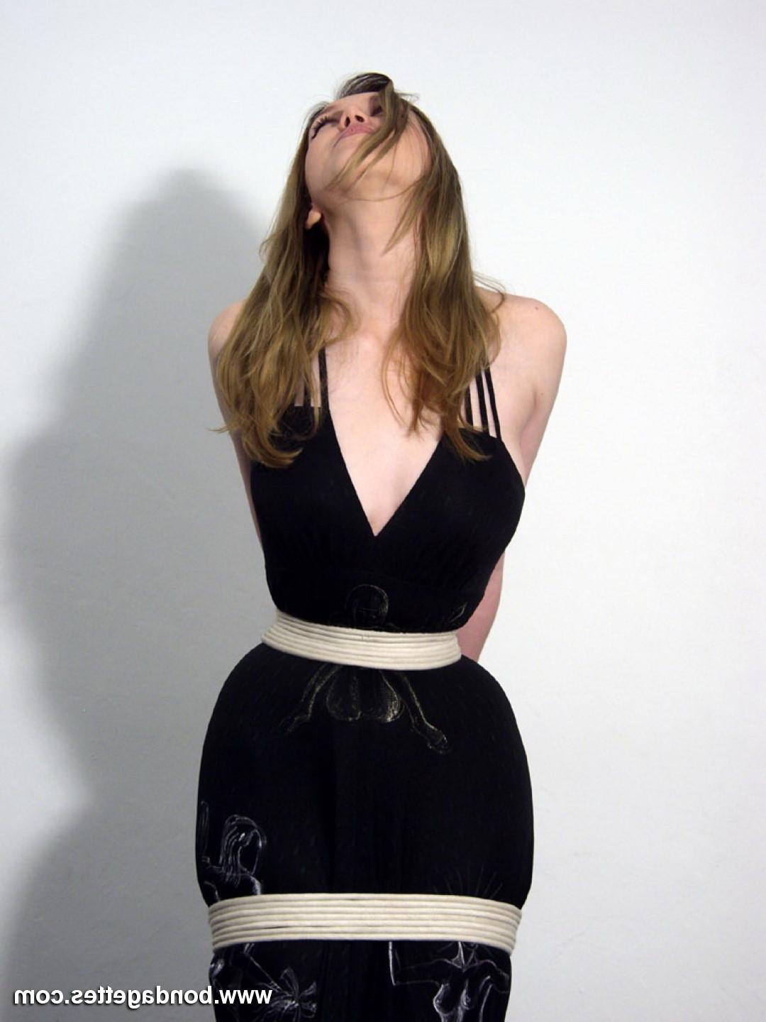16P Cute blonde is bound up in ropes on a chair