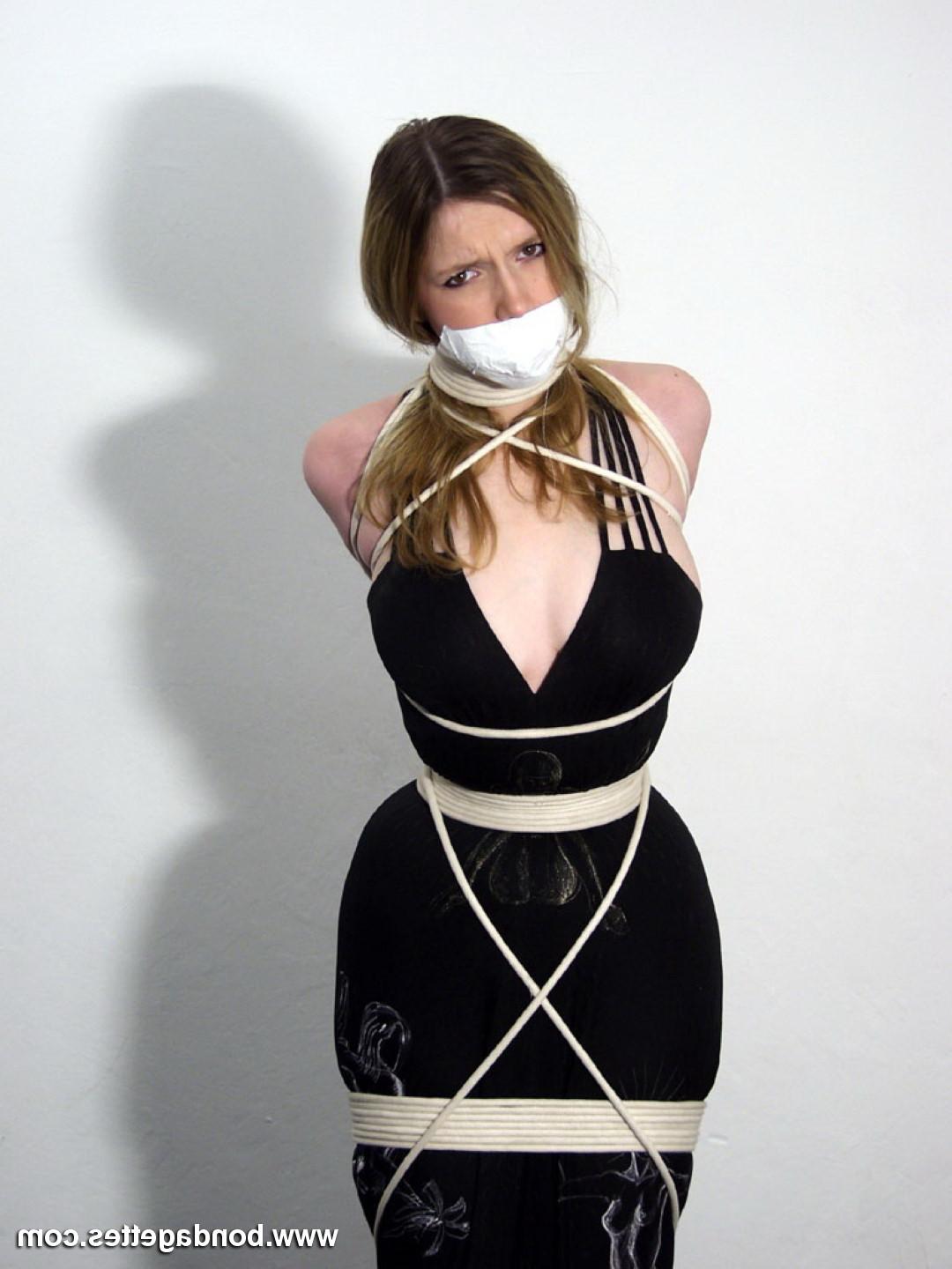 16P Cute blonde is bound up in ropes on a chair