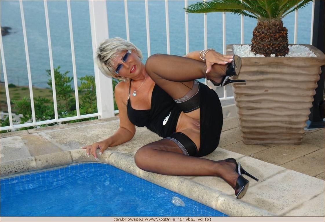 12P Lady Barbara in stockings smoking by the pool