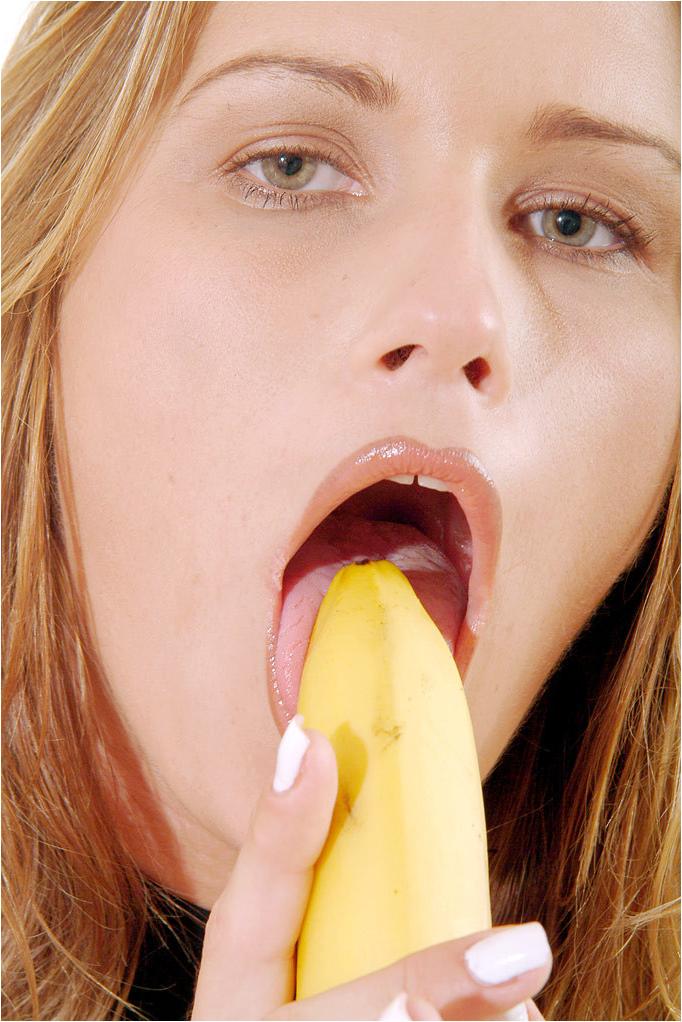 15P Beautiful blonde babe doing more with a banana than eating lunch
