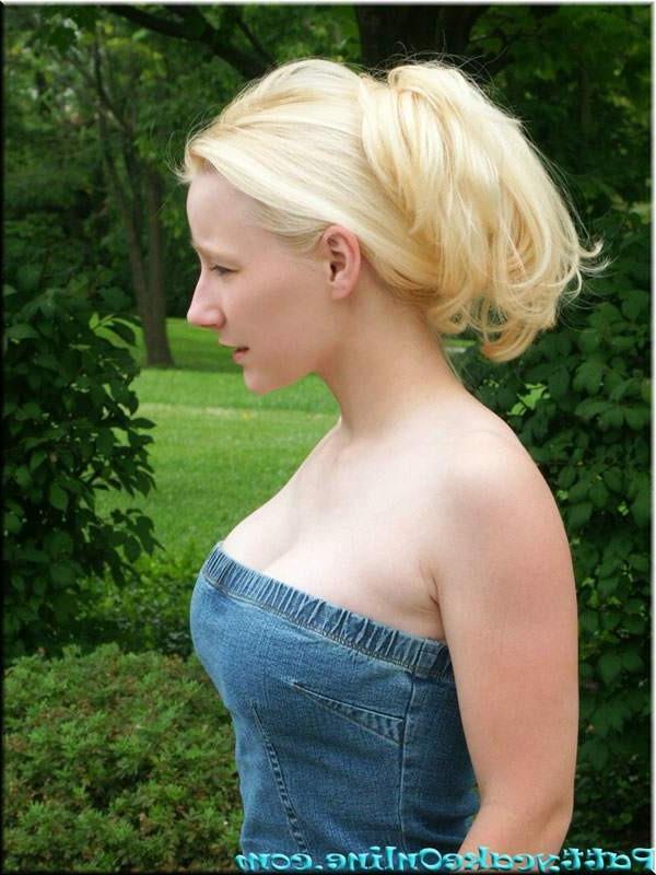 15P Young blonde student in summer dress waits at school