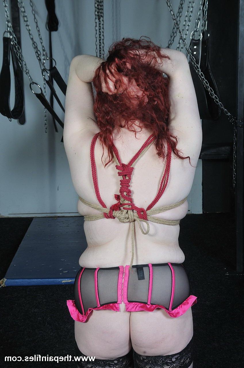 16P Amateur redhaired subbie is bound tightly to a bamboo pole by he
