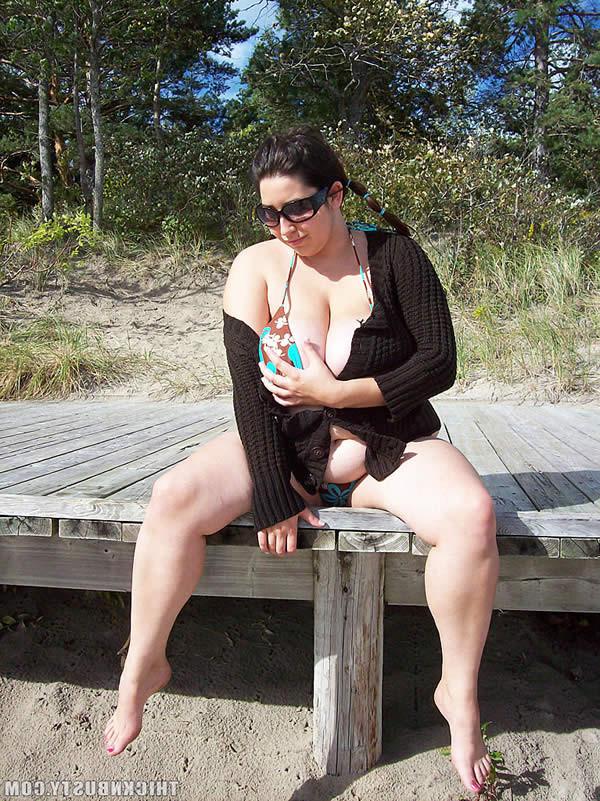 16P Busty brunette plumper shows her tits on the beach