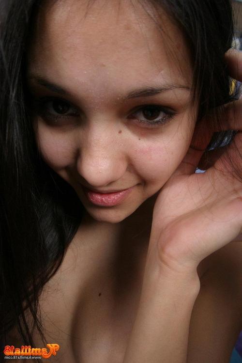 17P Tempting brunette teen shows her tanned nude body