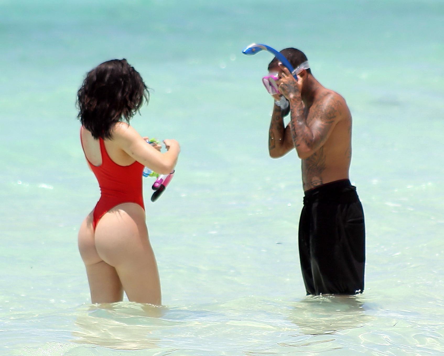 16P Kylie Jenner shows off her hot round ass in red swimsuit