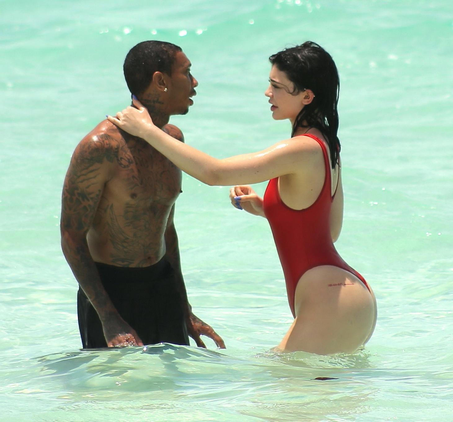 16P Kylie Jenner shows off her hot round ass in red swimsuit
