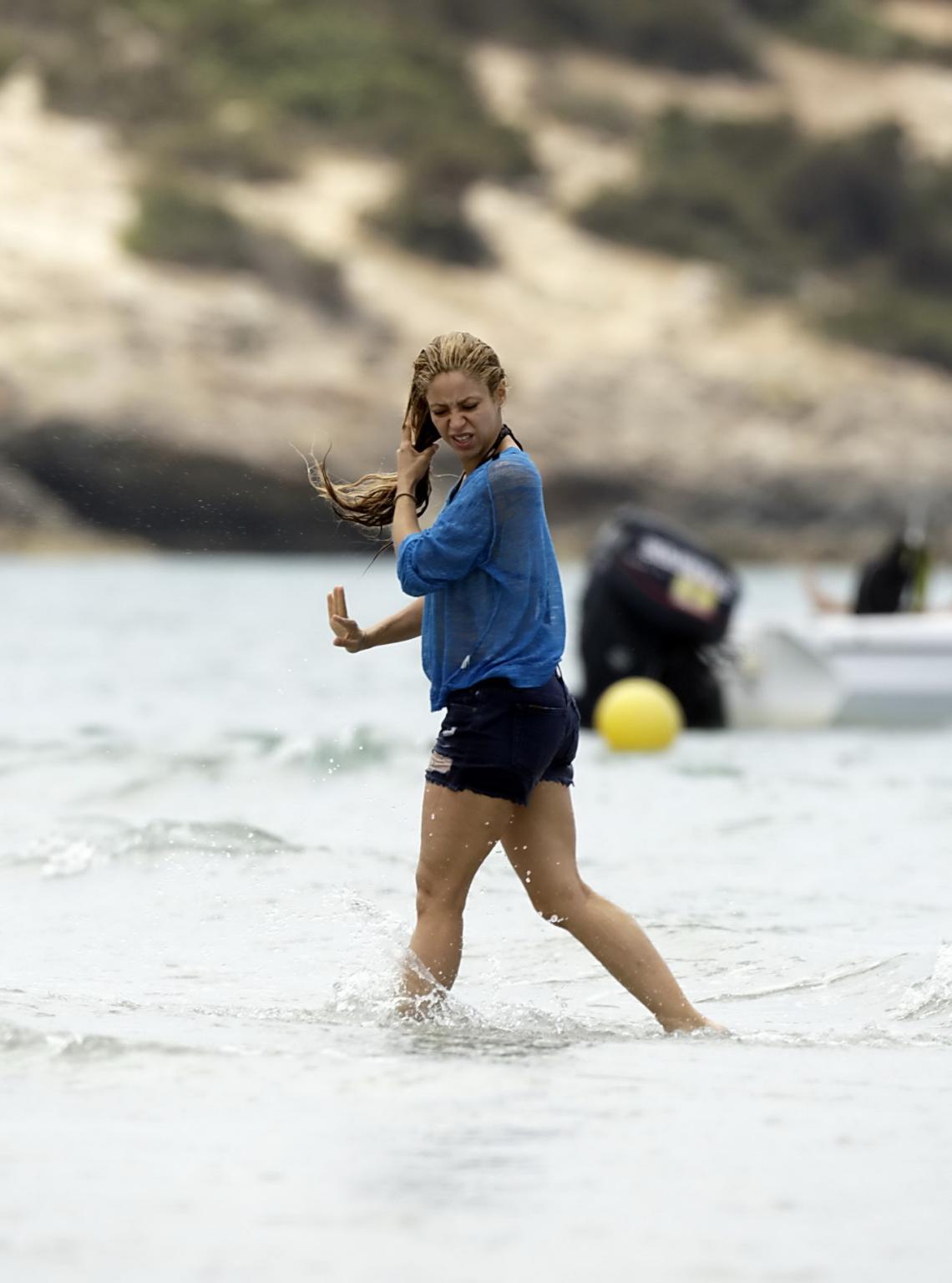 16P Shakira in a skimpy thong bikini at the beach