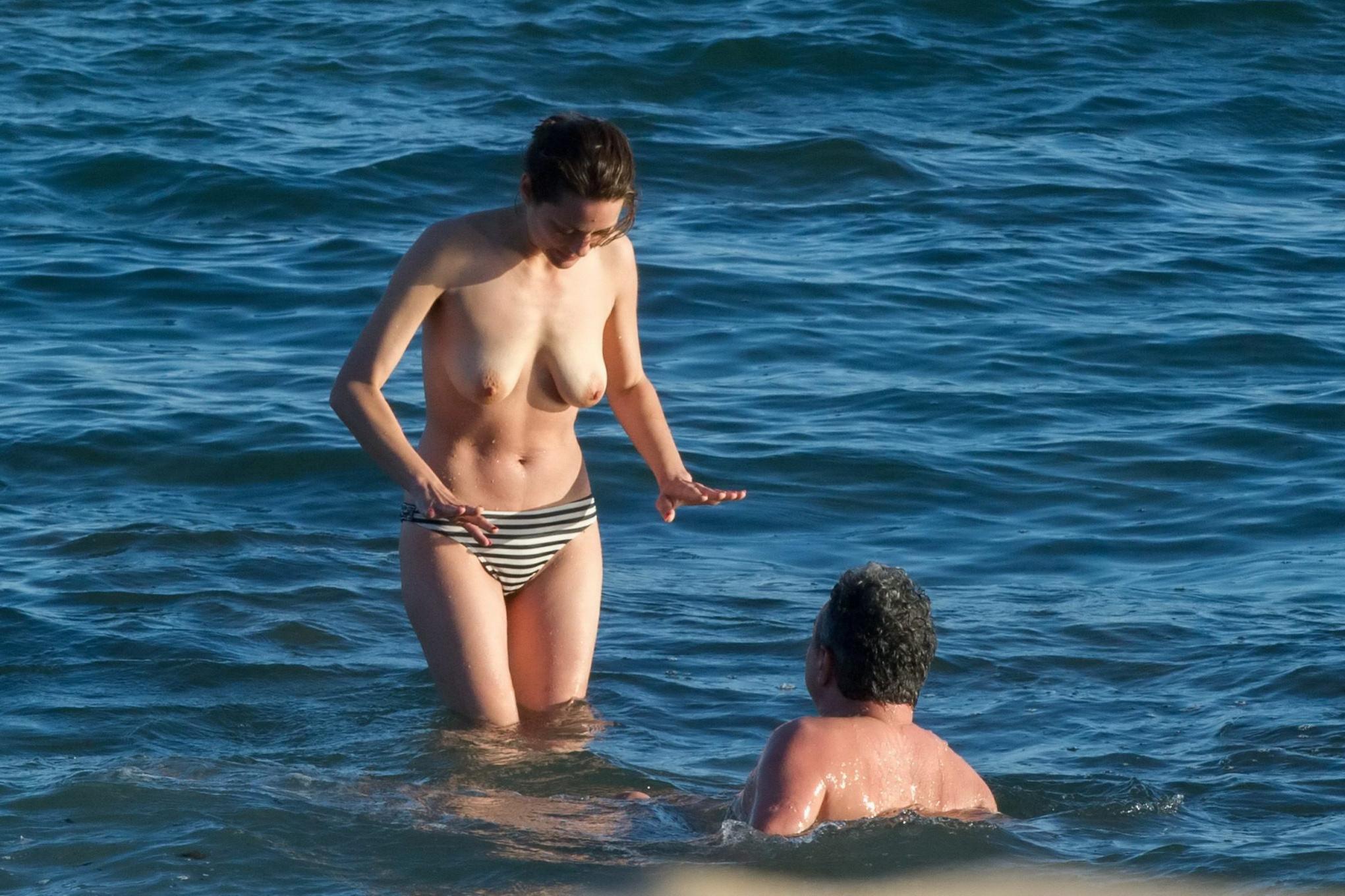 16P Marion Cotillard swimming topless at the beach