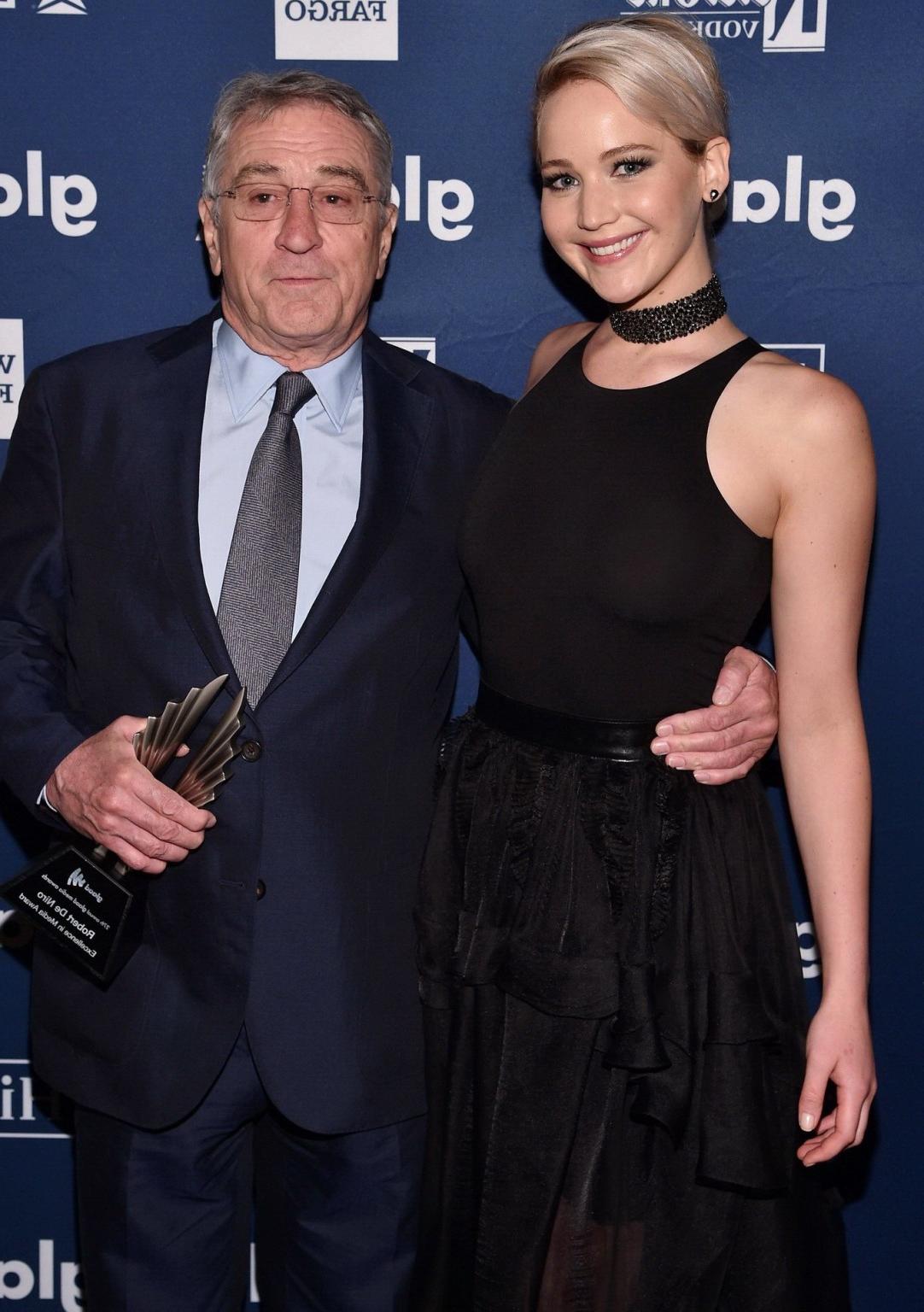 16P Jennifer Lawrence showing boobs in black sheer outfit
