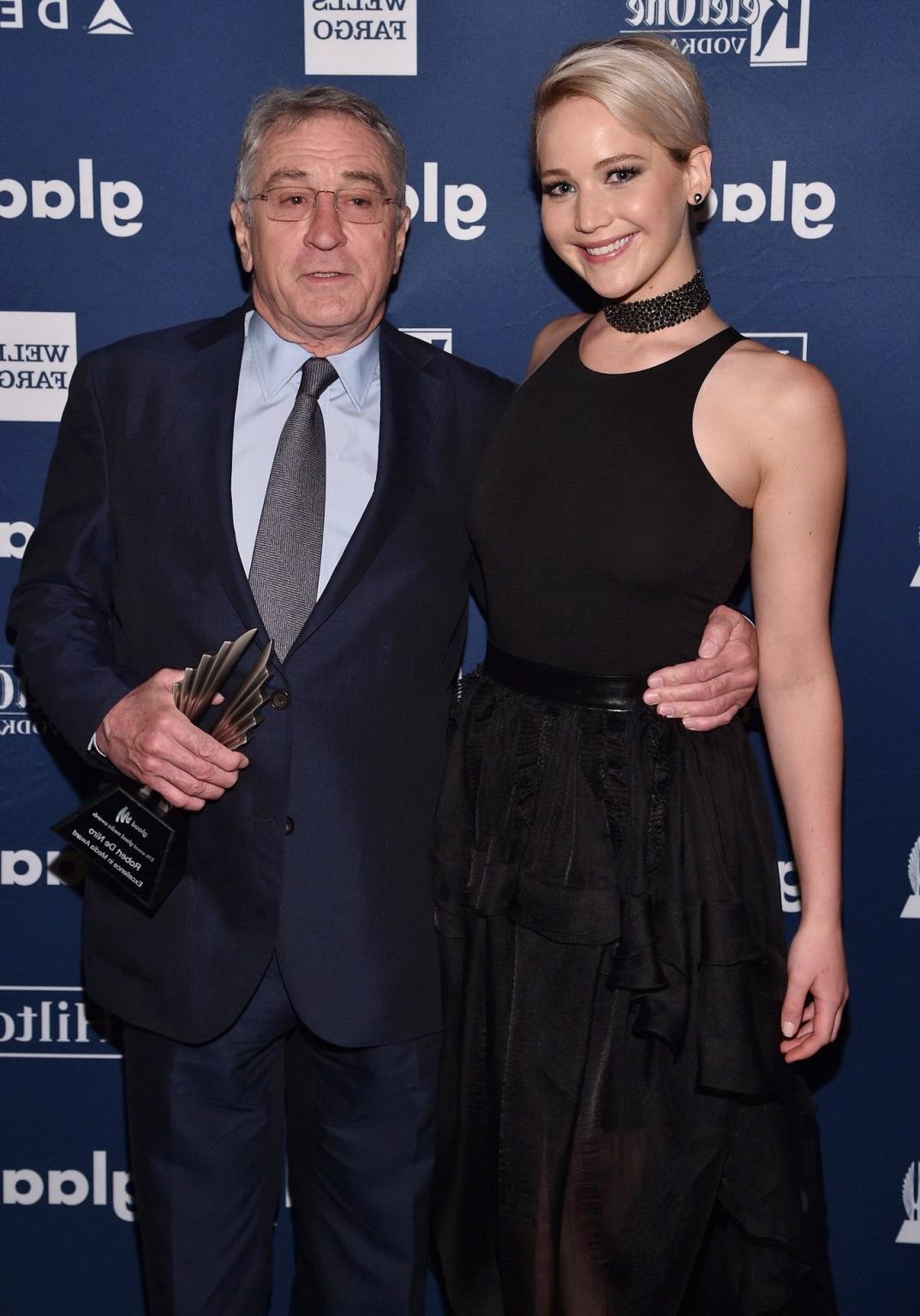 16P Jennifer Lawrence showing boobs in black sheer outfit