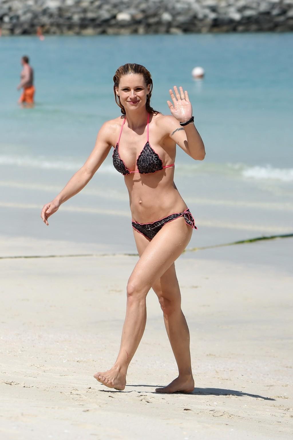 16P Michelle Hunziker flashing boobs and shaven crotch in bikini