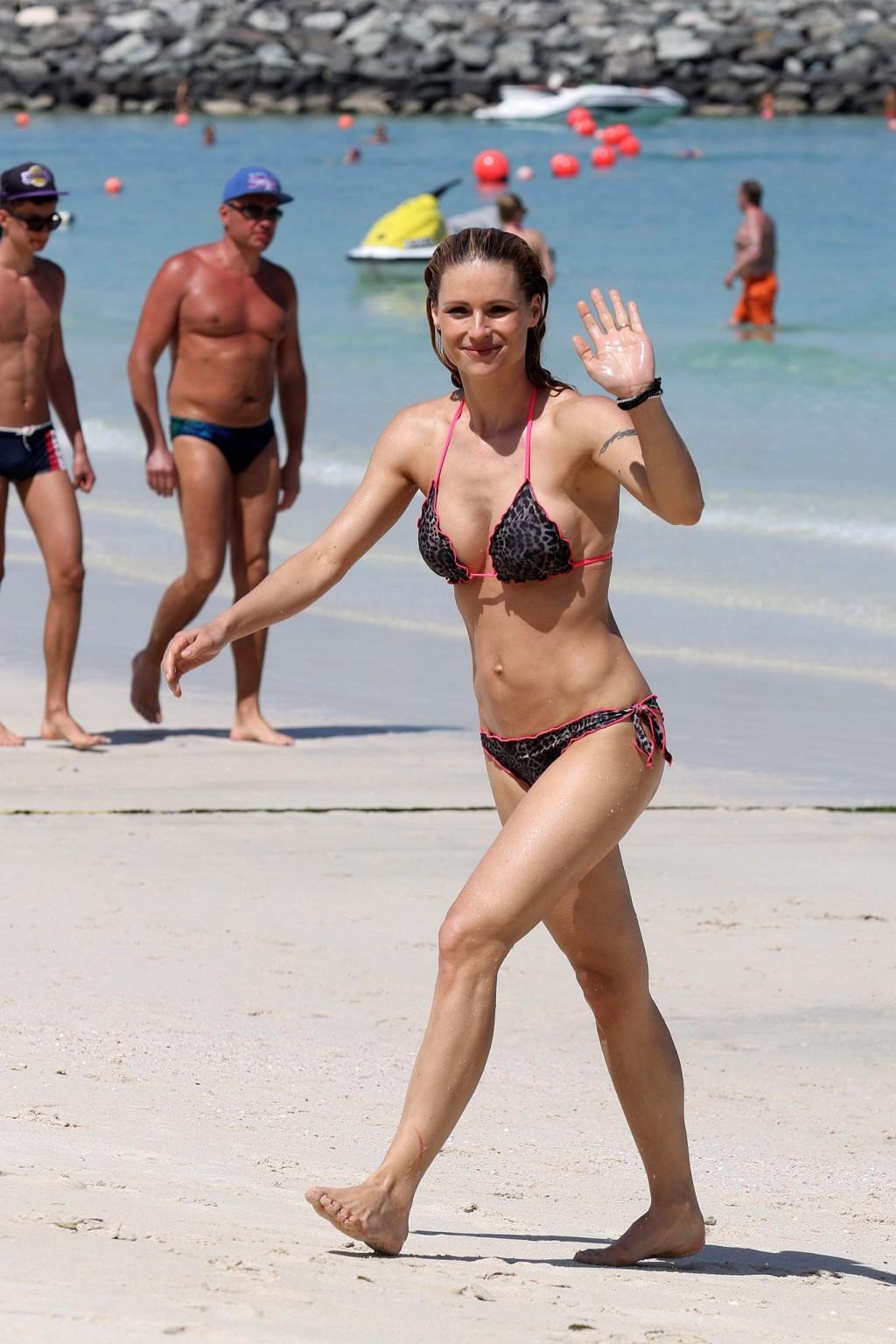 16P Michelle Hunziker flashing boobs and shaven crotch in bikini