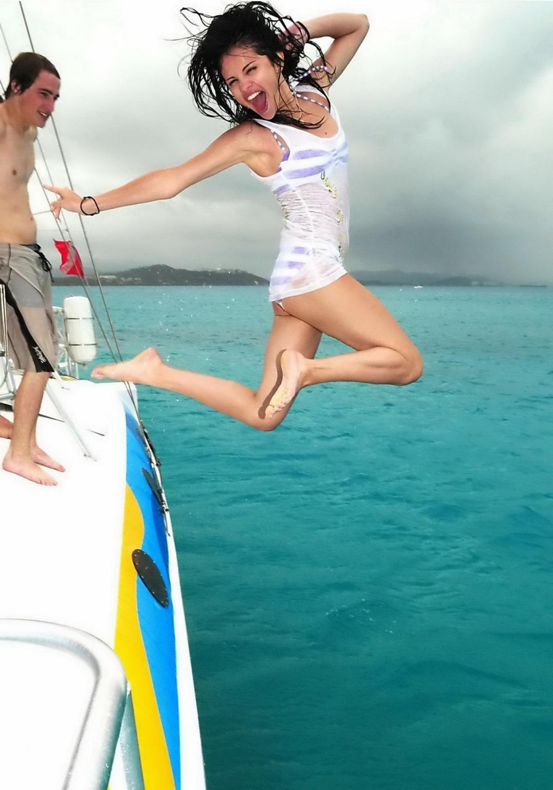 16P Selena Gomez in striped bikini and sheer top