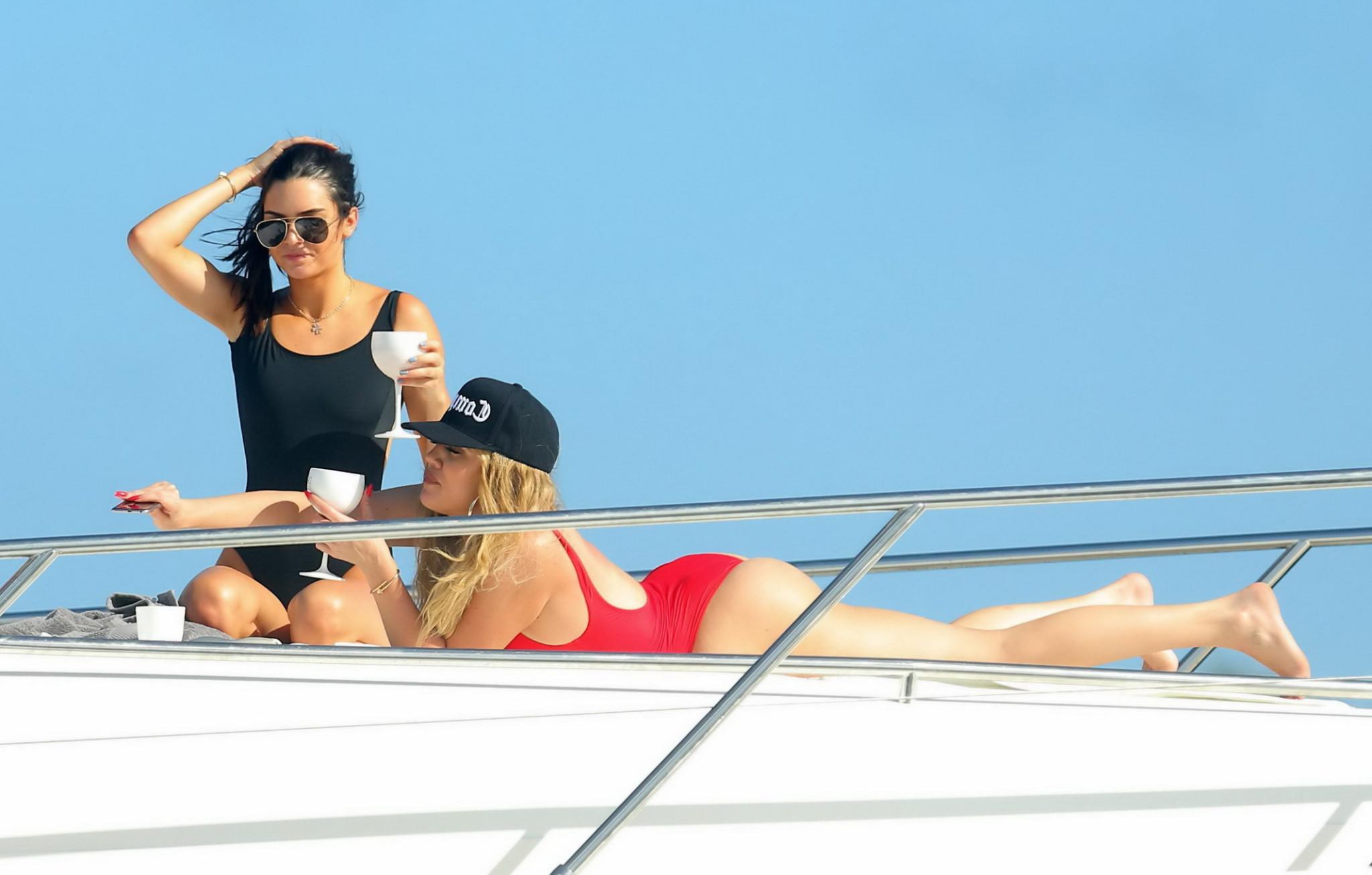 16P Khloe Kardashian and Kendall Jenner shows off bikini asses