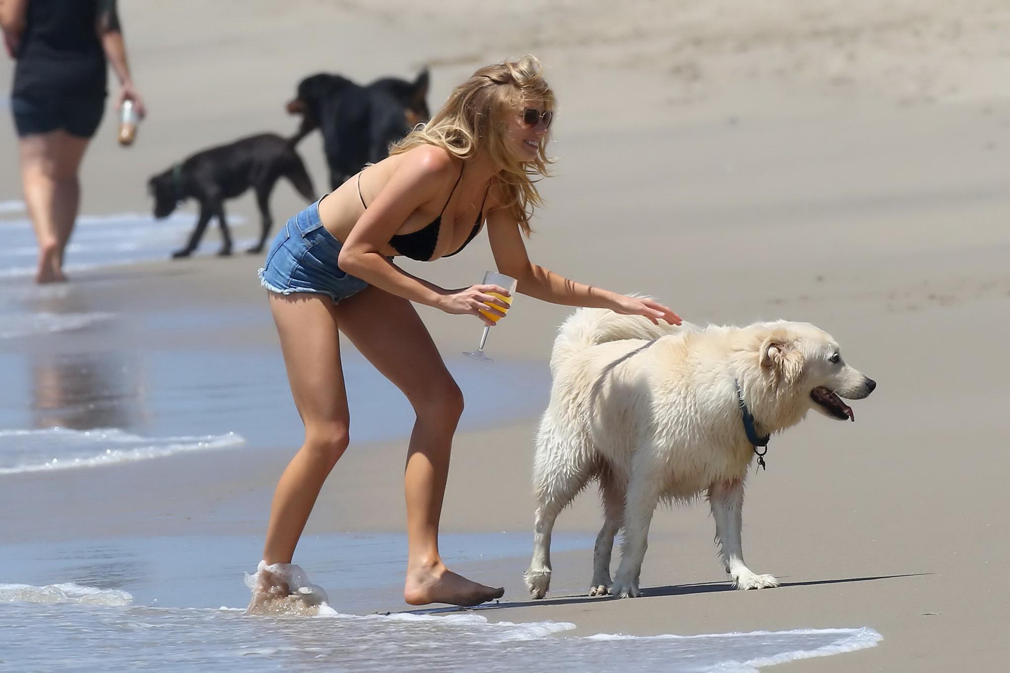 16P Charlotte McKinney showing melons in bikini top and shorts