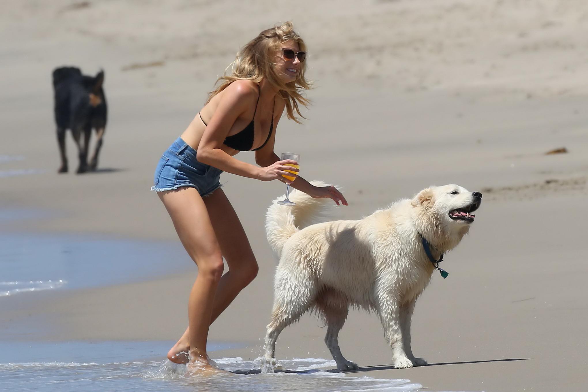 16P Charlotte McKinney showing melons in bikini top and shorts