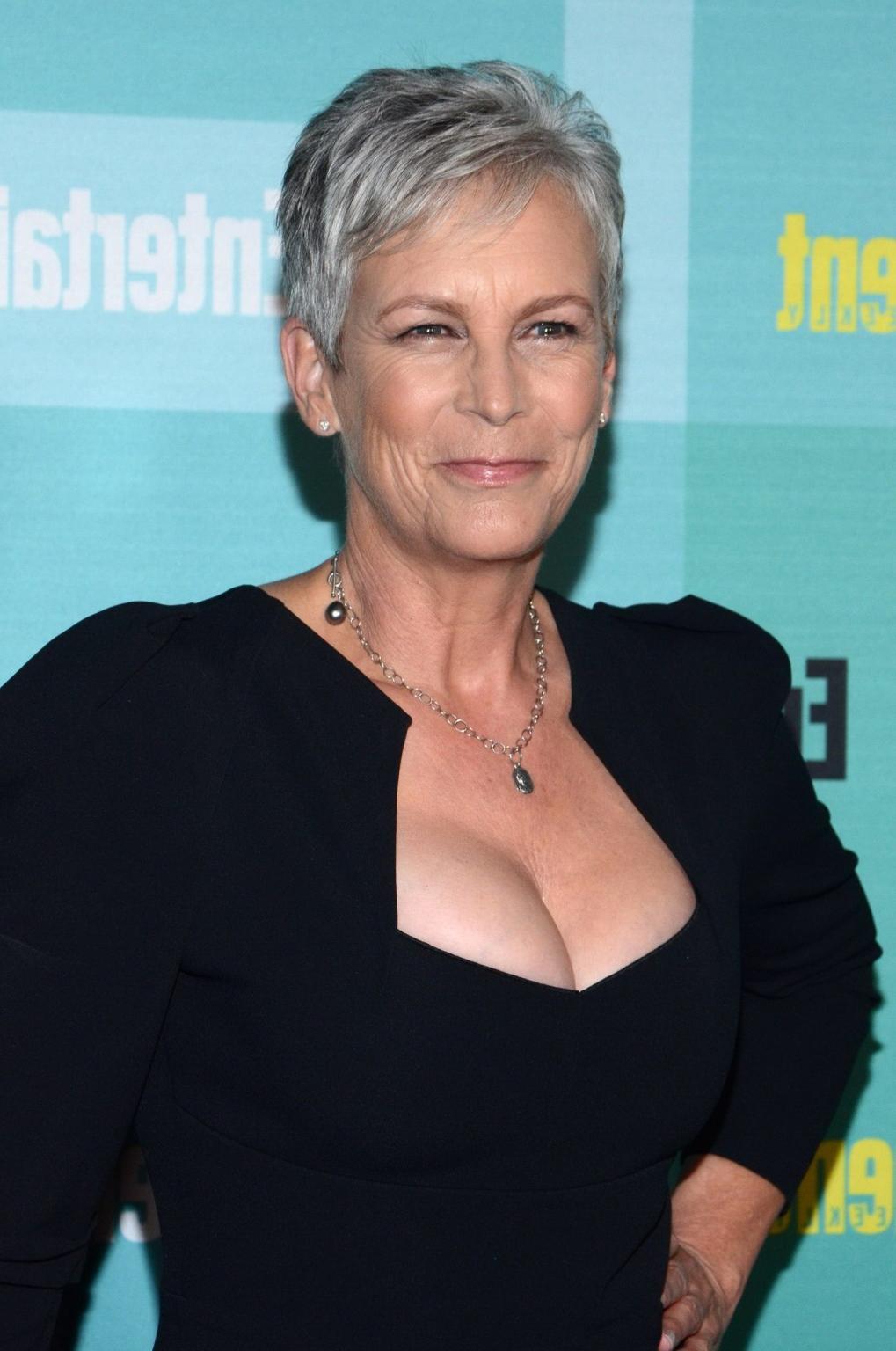 16P Jamie Lee Curtis shows cleavage wearing a low cut dress