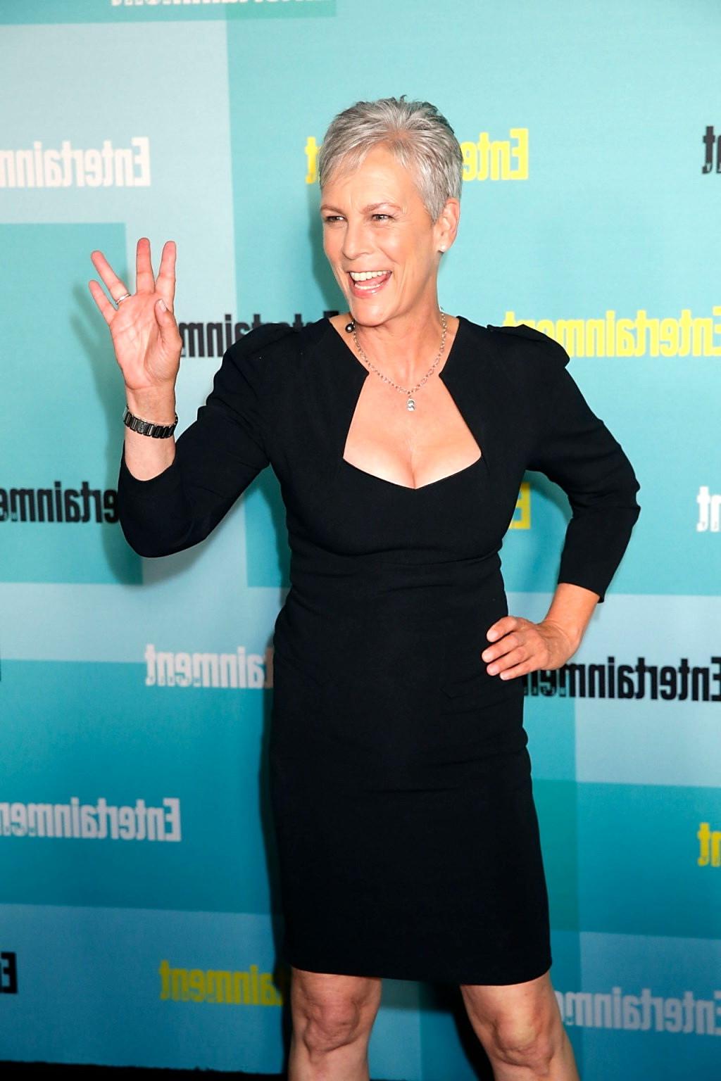 16P Jamie Lee Curtis shows cleavage wearing a low cut dress